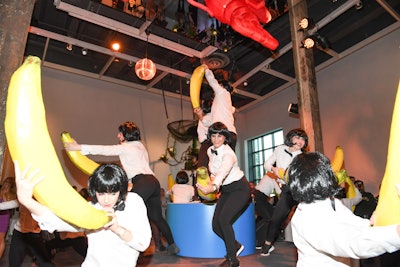 Attendees were also treated to a surrealist performance with dancers holding paper-mache bananas.