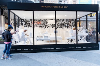 The Masterpiece Suite pop-up took place June 3 and 4 near New York's Penn Station. The glass-enclosed hotel room featured all-white furniture that served as a canvas for artist Aaron De La Cruz.
