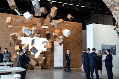 “We created an exhibit of art installations to illustrate stages of market cycles, highlighting Senator strategies of opportunity and success during those cycles. Here, we depict the ‘breakthrough’ that a traditional box maker had when they expanded from cardboard into the production of many more packaging products.” (Pictured: Senator Investment Group conference)