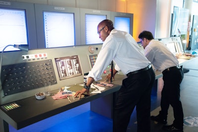 The Mission Control space featured replica desks and telemetry units to recreate NASA home base celebrations that happened in 1969. Actors portrayed NASA staff who conversed with guests and led celebratory moments with American flags throughout the event.