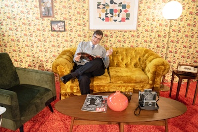 The first vignette presented a 1960s-inspired living room, which featured actors portraying a family gathering around the TV to watch the moon landing. The vignette included custom wallpaper and props such as a copy of Life magazine.