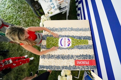 Linda Miller Nicholson helmed a collaborative pasta art installation at Peroni’s Grand Tasting booth. Guests were invited to shape fresh pasta, which was then used to create an image of the Italian beer brand's bottle against a striped background.