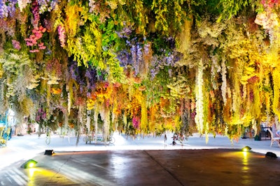 The meadow's “underbelly” featured FlowerCult's installation, which recalled previous Maison St-Germain events. Flowers and plants included light yellow achillea, dried light statice, white strawflower, Queen Anne’s lace, pink alliums, purple delphinium, fresh purple mist, eucalyptus, and jasmine vine.