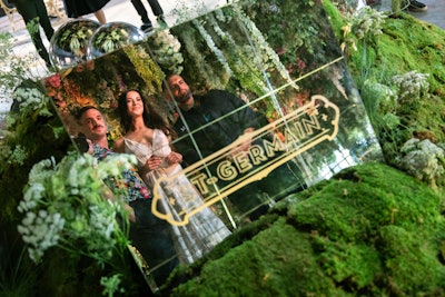 The floor of the venue featured a mirror so guests could see their reflection with the meadow above. ManscapersNY founders Garrett Magee, Mel Brasier, and James DeSantis posed for a photo.