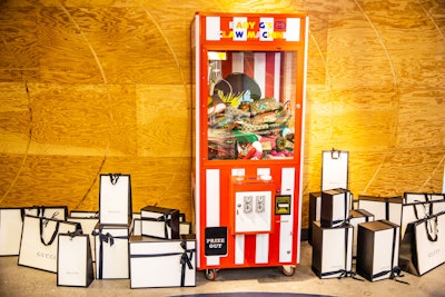 A custom claw machine featured Gucci kids and baby shoes, backpacks, fanny packs, and other accessories. Chiu paid for the items herself as gifts for party attendees.