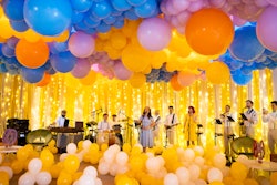 Hundreds of balloons filled the space, highlighting a performance by Dallas & Doll.