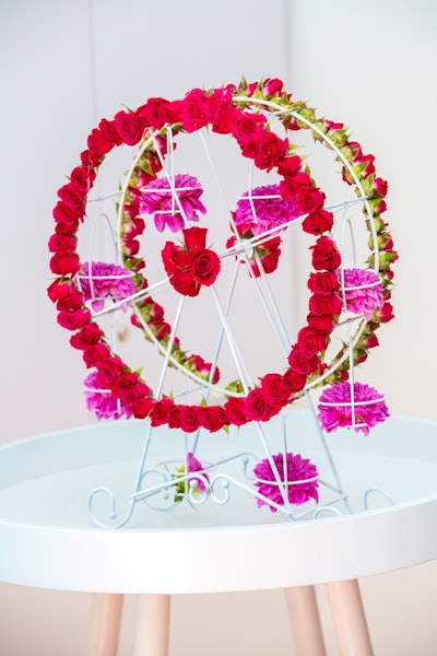 Smaller, floral-covered Ferris wheels provided additional decor throughout the event.