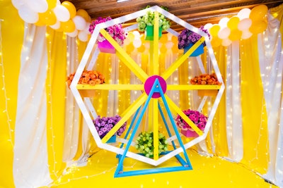 An oversize Ferris wheel filled with flowers offered an on-theme backdrop for photos.