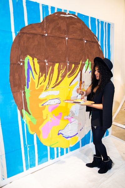 Artist Avamae created a custom mural throughout the day.