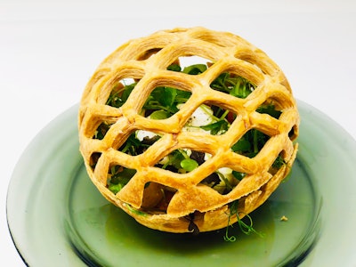 Heirloom green tomatoes, burrata, smoked pepper pesto, and micro herbs underneath an edible lattice dome, served with a small wooden hammer, by Creative Edge Parties in New York