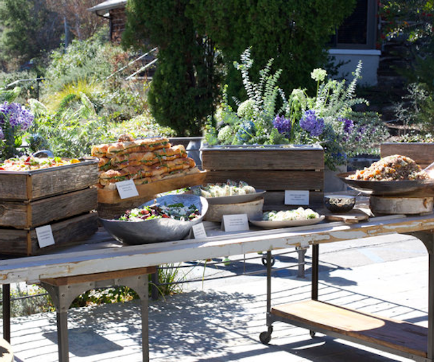 The Lodge at Malibou Lake's front porch buffet welcomes guests with rustic charm.