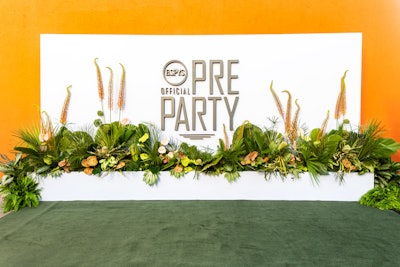 Fiore Designs handled florals, which included a greenery-filled photo op at the entrance to the event.