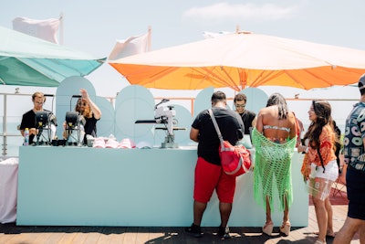 The 'Dad Hat' station invited guests to use a digital kiosk to create a custom patch, which then was applied on site. Most attendees chose to customize with their own Instagram handle.