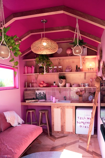 The inside of the pink house featured pink props, furniture, and letters on a mini fridge that paid homage to A Star Is Born.