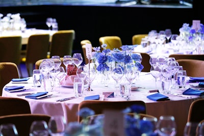 The V.I.P. dinner featured simple blue and white florals as centerpieces, tying into the blue tones of the stage design.