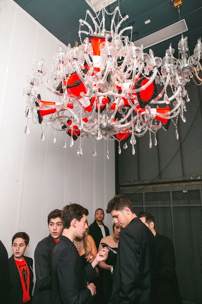 A freight elevator, decked out with grand chandeliers strewn with orange and white traffic cones, took guests to pre-dinner cocktails.