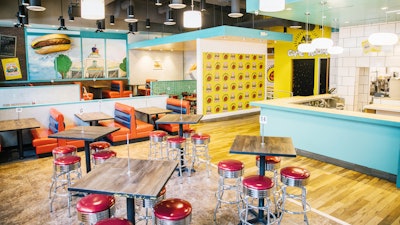 To promote the return of Nickelodeon's All That sketch comedy series, the network opened a pop-up dining experience this week that's inspired by the old Good Burger sketch starring Kenan Thompson and Kel Mitchell. Open through the end of 2019, the nostalgic space—created by the same team behind the recent 'Saved by the Max' pop-up—serves food from local chef Alvin Cailan, founder of Eggslut. The pop-up, which was designed by multidisciplinary artist Floyd A. Davis IV, also has photo moments, games, merchandise, and, as fans can appreciate, plenty of orange soda.