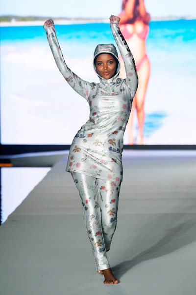 Model Halima Aden, a former Miss Minnesota contestant, opened the show in a hijab and burkini custom-designed by designer Cynthia Rowley.