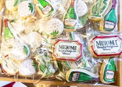Take-home treats for guests included cookies frosted with the brand logo and cookies shaped like golf bags and golf balls. The cookies were created by Cades Cakes.