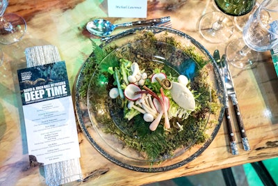 For the donor dinner's first course, Occasions Caterers envisioned a “forest floor” of mosses and ferns covered with a glass plate. The 'Carboniferous forest' salad was composed of earthy ingredients like wild mushrooms, ramps, pickled fiddlehead ferns, and white truffle custard.