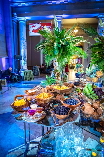 The museum's rotunda felt like a jungle, thanks to an abundance of greenery. A buffet was set up to resemble an archaeologist's base station in Khartoum, with vibrant displays of tropical and Middle Eastern fresh fruit displayed as a fruit market at the souk.
