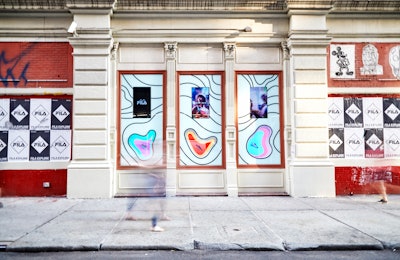 The outside of the pop-up draws passersby with street-style signs and window displays of sneakers surrounded by the store’s topographical pattern. The pop-up is open through August 11.