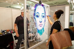 Art of Everyone turns the audience into the artist. Essentially, a 'conductor' stands behind a large canvas and begins outlining an image using a laser pointer. Participants stand on the other side of the canvas and apply paint by following the laser. The result is a high-quality work of art crowd-sourced by attendees. Art styles can range from portraits to abstract to landscapes and still lifes. Art of Everyone has appeared at events such as the World Business Forum and Content Marketing World, and has also created public activations for brands around the U.S.