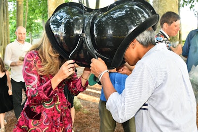 Hung between trees near a circle of stone monoliths, 'Mirror Box' by Megan May Daalder invited pairs of guests to place their heads in an immersive headset that gave the sensation of sharing one face.