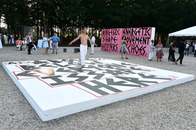 Sited on one of Lance De Los Reyes's canvas artworks was Jokubas Nosovas's 'Standing In White Pants' performance piece: the Lithuanian performer and breakdancer standing on a central canvas.