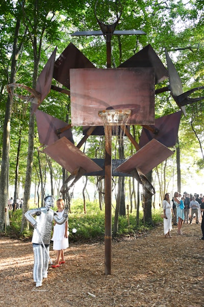 One of the evening's more popular works was 'Untitled' by John Margaritis, with performances by Robert Wilson. First presented at Art Basel Miami 2018, the rotating basketball sculpture, installed at an intersection in the woods, featured Tin Man and Dorothy-like characters slowly moving around the woods, the former occasionally striking the metal sculpture.