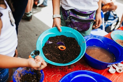 Kids gathered to participate at free, family-friendly activities hosted on Larimer Square, which included D.I.Y. kitchen herb gardens, storytelling hours, and school garden sessions.