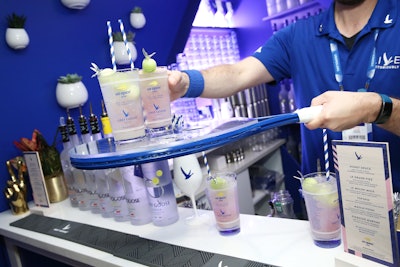 The bar serves cocktails such as the Honey Deuce, the brand’s signature tennis-theme drink, on branded tennis rackets.