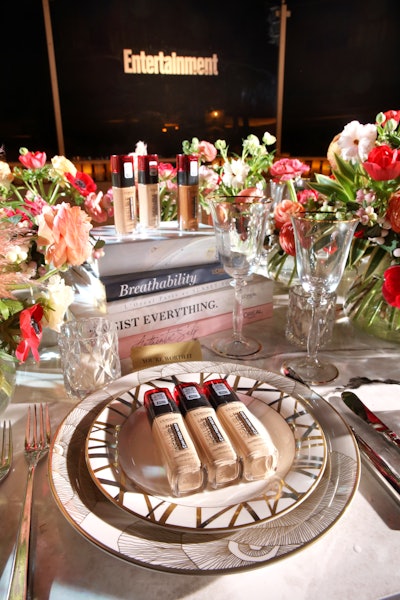 The table, which had flowers from Floral Crush Studio, was decorated with L'Oréal Paris products, coffee-table books, and china by Kelly Wearstler.