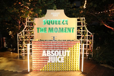 A custom DJ booth covered in apples and strawberries had a “Squeeze the Moment” Absolut Juice backdrop.