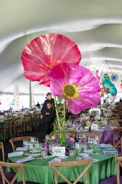 Inspired by the work of Chihuly, oversize flower sculptures sprang from the center of dinner tables.
