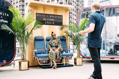 Guests could pose for a photo in real airplane seats below a welcome sign customized for them.