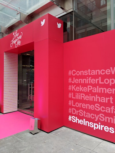 The event entrance featured a pink carpet and an archway that displayed the #SheInspiresMe tagline and names of the film cast, director, and panel moderator in hashtags.