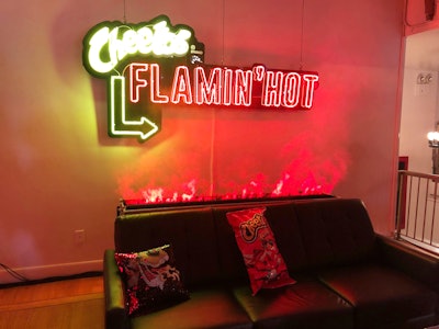 Another photo op featured a couch with a faux flame effect and sequin pillows with an illustration of the brand's mascot, Chester Cheetah.