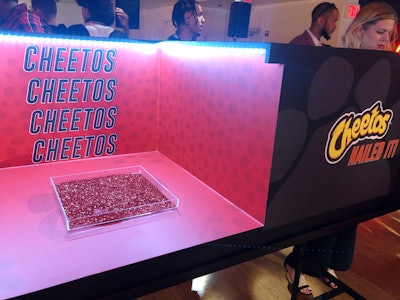 Guests who chose the 'Caught Snacking Nails' service could show off their new polish in boxes inspired by red carpet 'mani cams.'