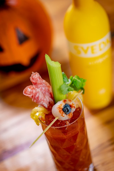 Svedka has partnered with Cody Goldstein, mixologist and founder of Muddling Memories, to create a series of Halloween-inspired cocktails. The 'Bloody Carrie' cocktail is a Bloody Mary garnished with a celery stalk, banana peppers, cilantro sprig, and olives stuffed with salami. The 'eyeball' can also be made using Lychee stuffed with a blueberry.