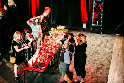 To celebrate the first season of The Chilling Adventures of Sabrina, Netflix worked with creative agency MKG to build an immersive, interactive house in Hollywood in October 2018. Guests were asked to choose between the show’s normal Baxter High and witch-filled Academy of Unseen Arts. During the fan portion of the activation, guests could make their own autumn-inspired floral crowns (choosing between light and dark flowers) and get nail art that included spiders, black cats, and Baxter High’s logo.
