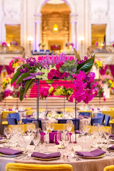 Blueprint's in-house floral studio designed magenta and violet floral centerpieces.