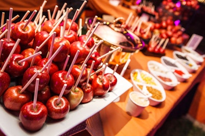 A Halloween-theme party at Paramount Studios in Los Angeles featured a build-your-own candy apple apple bar. Chad Hudson Events produced the event, which also included illuminated jack-o’-lanterns and spiderweb gobos.