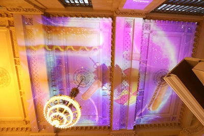 The stunt featured purple, dreamlike projections on the ceiling of the venue, with imagery that included hot dogs from a street cart.