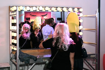 Guests could try on wigs and write messages at a mirror selfie booth.