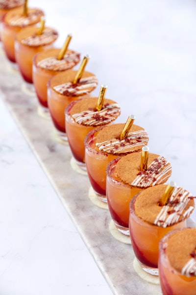 This year, Abigail Kirsch has partnered with Bryant Park's Overlook, which is located next to the ice skating rink in the Winter Village, to provide catering options including cider bourbon slushies with a ginger shortbread cookie topper.