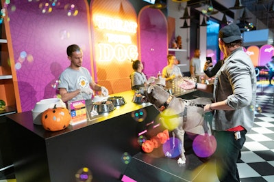 Inspired by a 1950s malt shop, a snack bar offers humans ice cream sundaes and dogs their own sundaes. Dogs can run up a ramp to sample the menu. The bar also featured maple-scented bubbles.