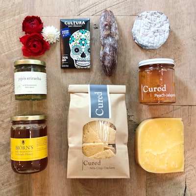 Boulder, Colorado-based gourmet grocery Cured offers both click-and-buy and customizable gift boxes, which can be delivered throughout the U.S. Pictured: The Colorado Flagship Box ($150) features a mix of local cheeses, meats, spreads, and more.