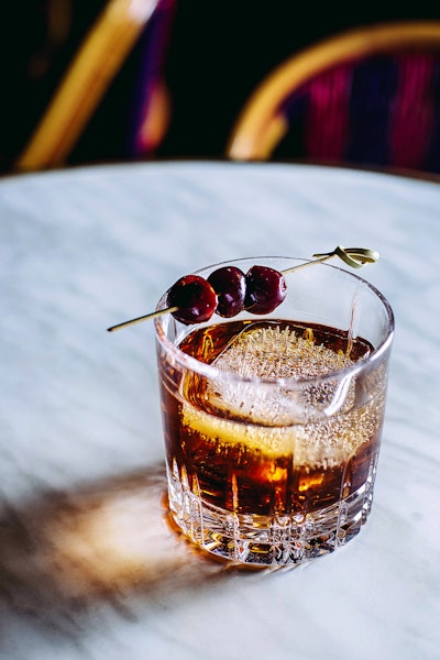Inside, sip on the vintage-inspired GG Manhattan, made with Woodford Reserve bourbon, Carpano Antica vermouth, and angostura bitters.
