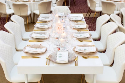 Blueprint Studios’ white Cyrus chairs (pricing available upon request) with a quilted back and rose gold legs add a sleek touch to a holiday dining setup.